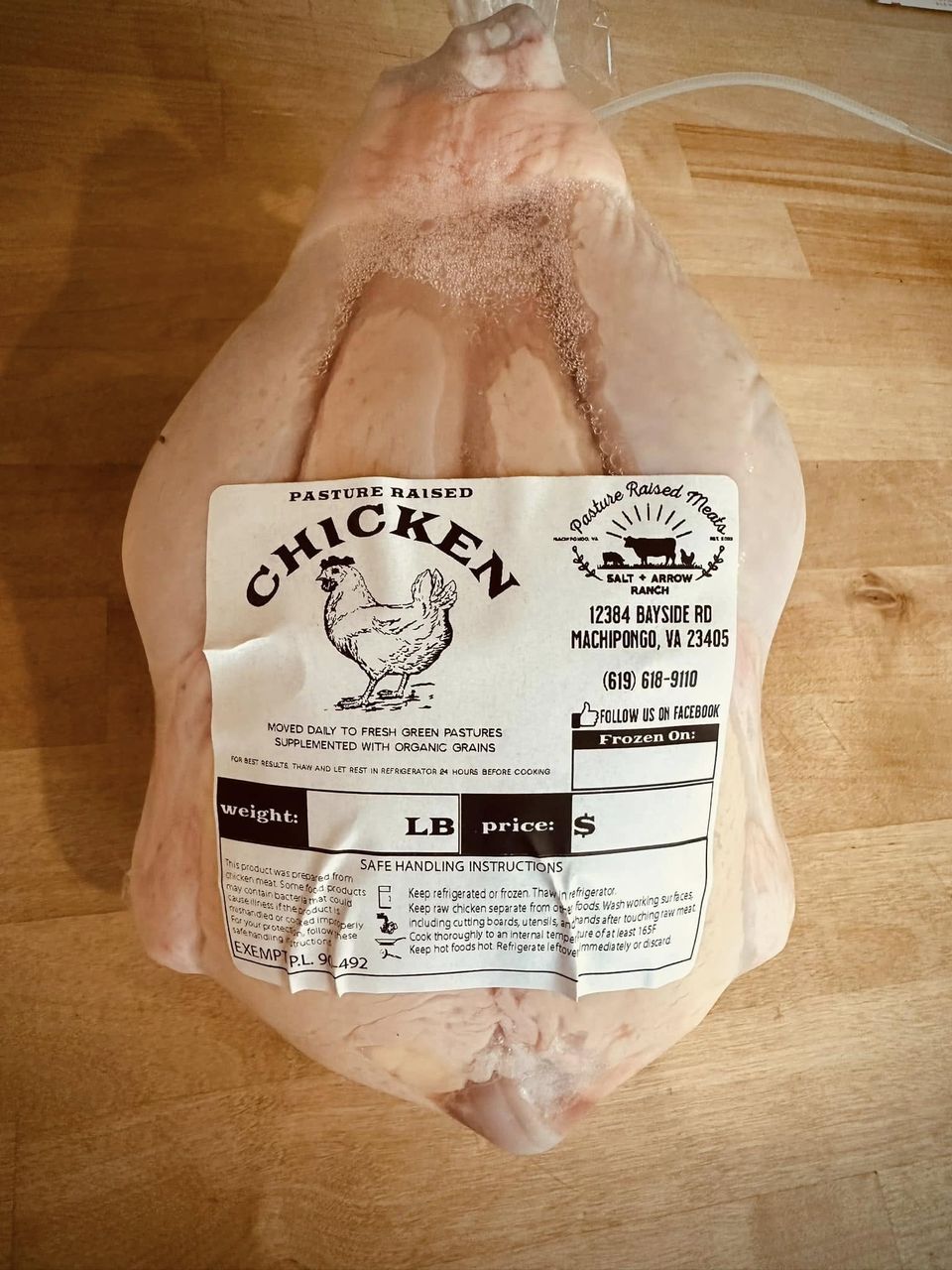 Whole pasture-raised chicken in Salt + Arrow Ranch packaging